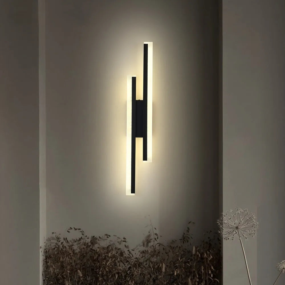 Modern gold and white 500mm double line wall lamp on a plain wall.