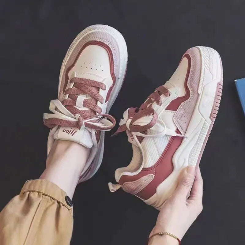 Women's pink and white height increasing rubber sneakers with low-top design