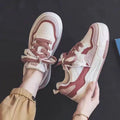 Women's pink and white height increasing rubber sneakers with low-top design