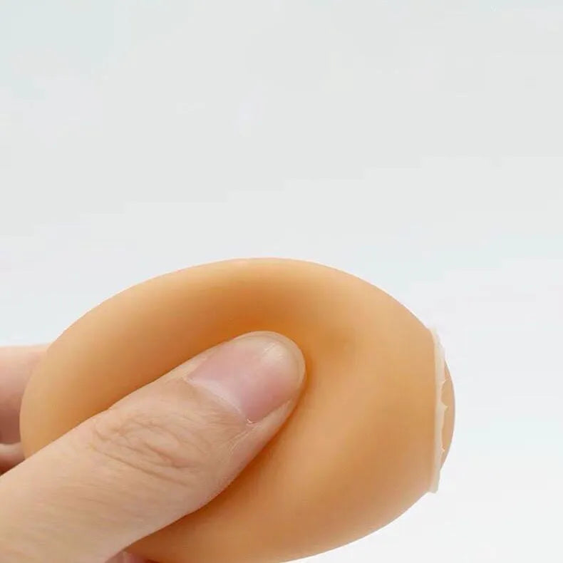 White simulation egg shaped dog toy with textured surface for teeth cleaning