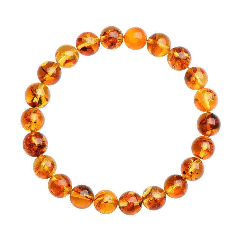 Natural yellow piebald amber bracelet with geometry beads on wrist