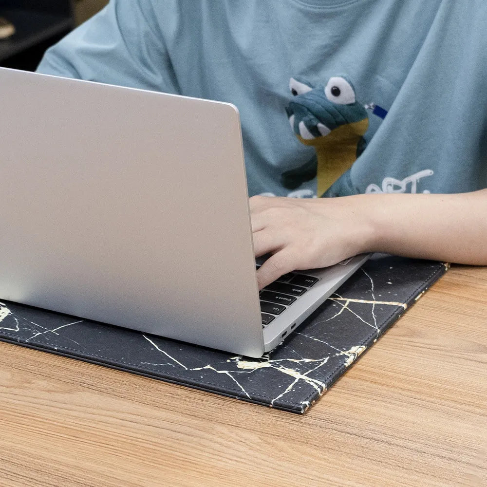 Anti-radiation printing tablet pad in multiple colours on a desk with a printer.