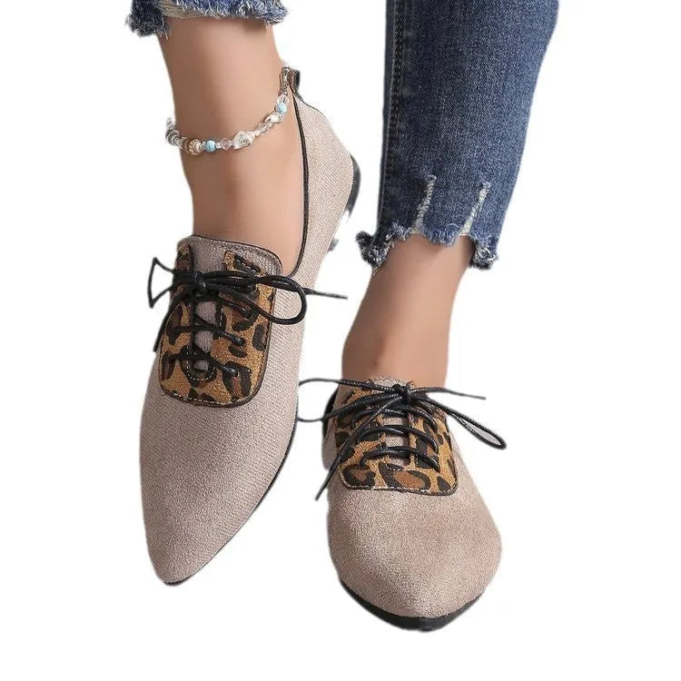 Beige leopard print women's pointed toe pumps with a faux PU upper and rubber sole.