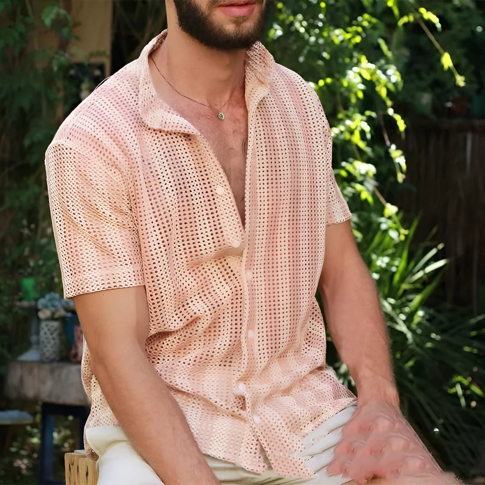 Pink loose-fit men's cardigan shirt with waffle texture fabric on a hanger.