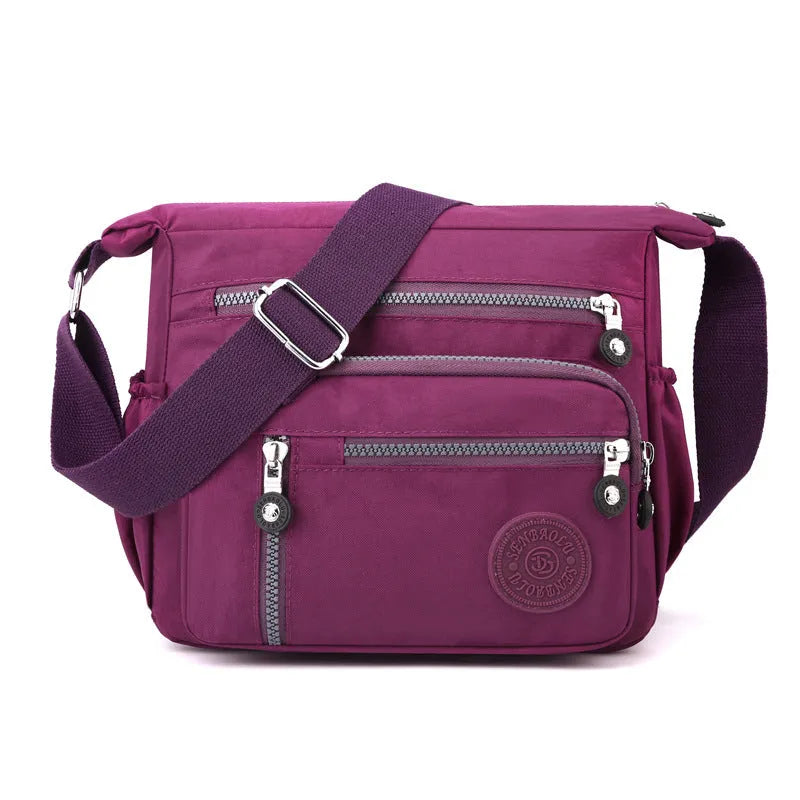 Grey soft nylon messenger bag with single adjustable shoulder strap showing square vertical shape