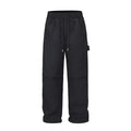 Black baggy paratrooper pants with an elastic waistband on a neutral background.