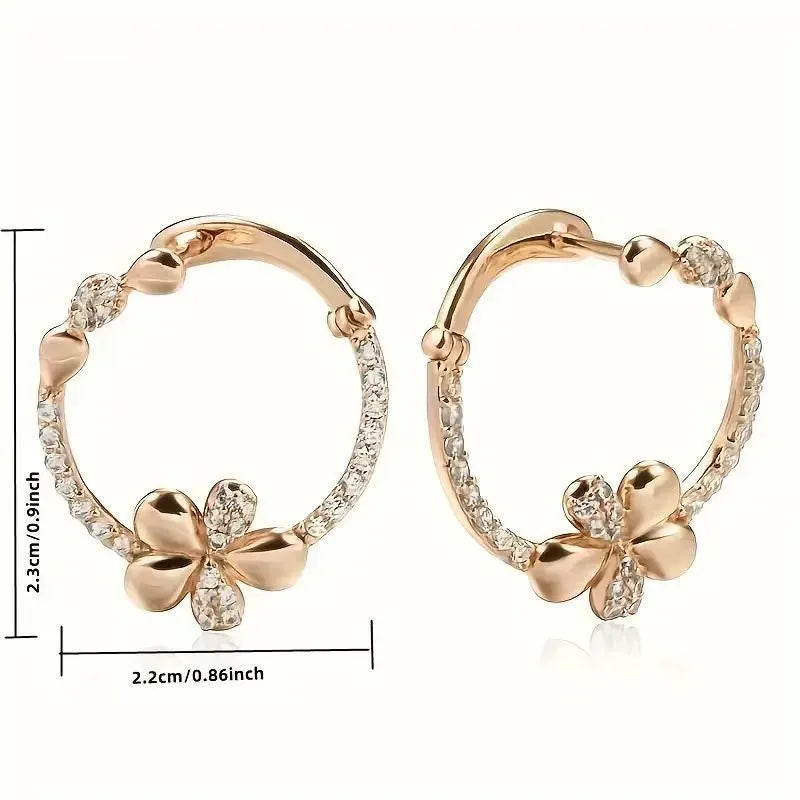 A pair of silver-colour round ring earrings for women on a white background.