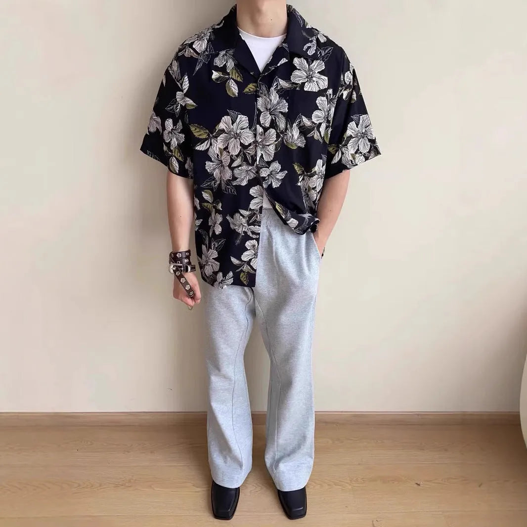 Black men's vintage Cuban collar shirt with floral print, made from ice silk fabric with short sleeves.