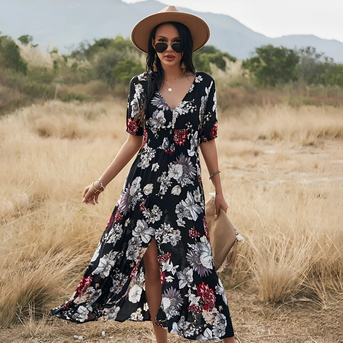 Yellow floral print women's dress with V-neck, short sleeves, elastic high waist, and flowing mid-length skirt.