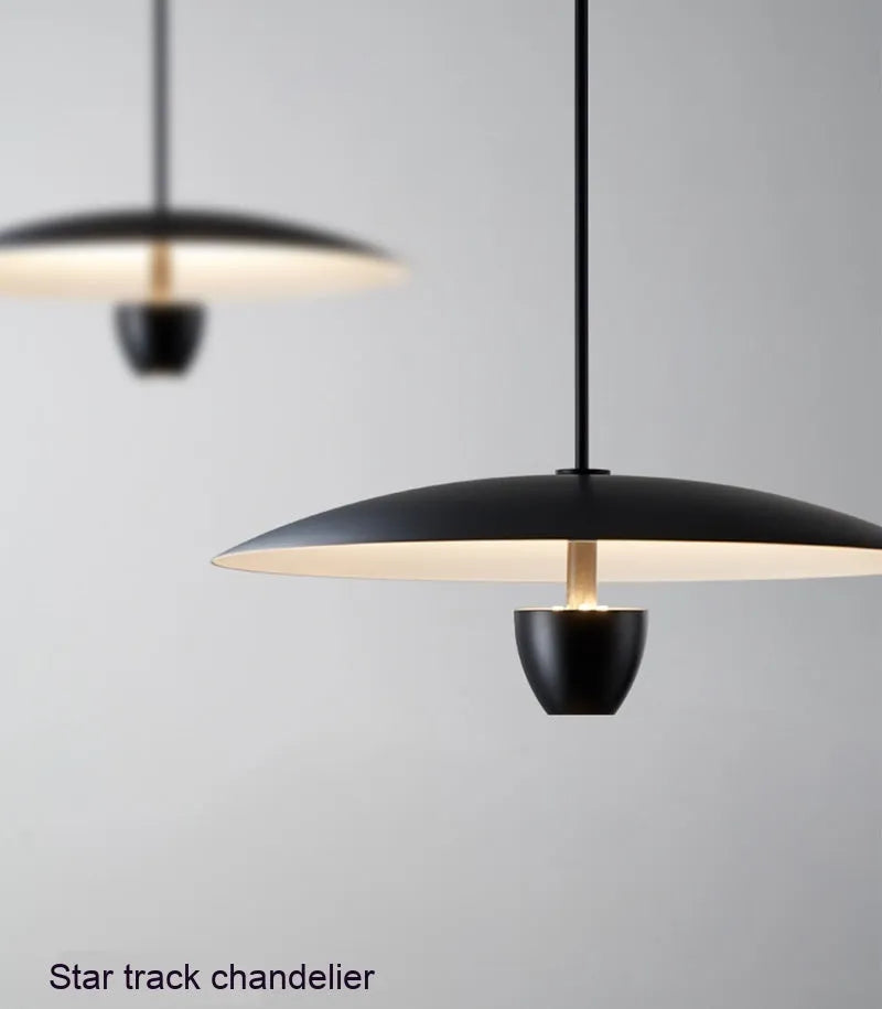Black modern minimalist chandelier with clean lines and warm lighting