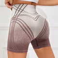 Women's high-waisted gradient fitness shorts in black or brown with Monsters Inc design for yoga and running