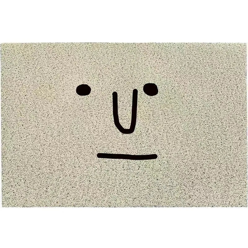 Square PVC floor mat with cartoon facial expression and geometric pattern in Mr. Big Nose colour.