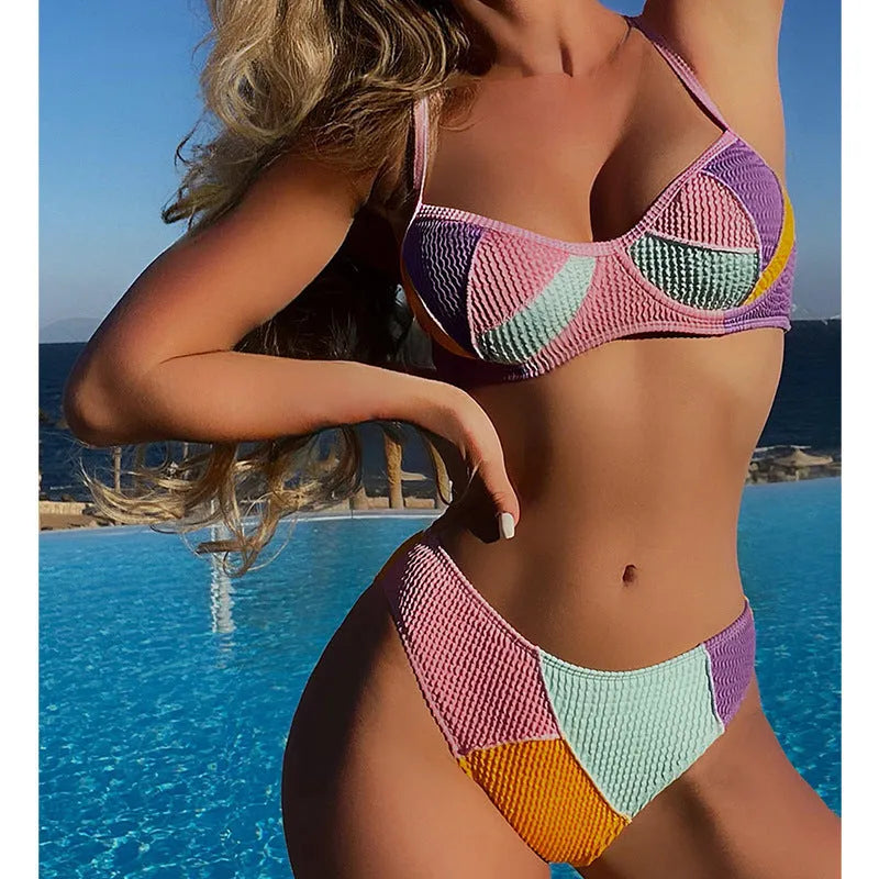 Ladies splicing colour bikini set with push-up top featuring internal steel bracket support and matching shorts.