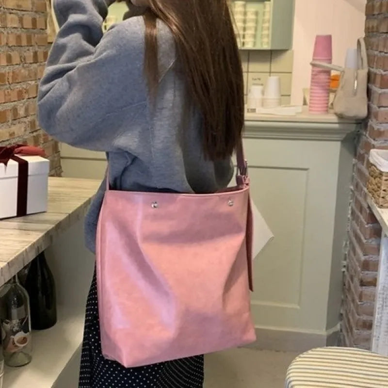 Corduroy one-shoulder commuter bag in pink or brown colour with 39cm length