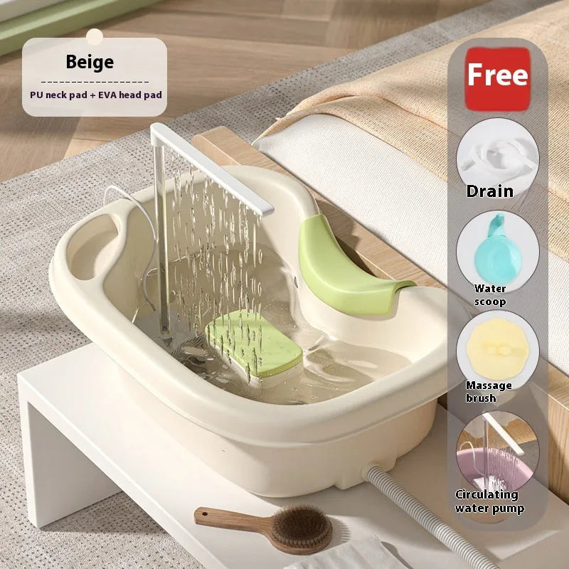 Portable plastic shampoo basin with head pad, circulating pump and massage brush for bed use.