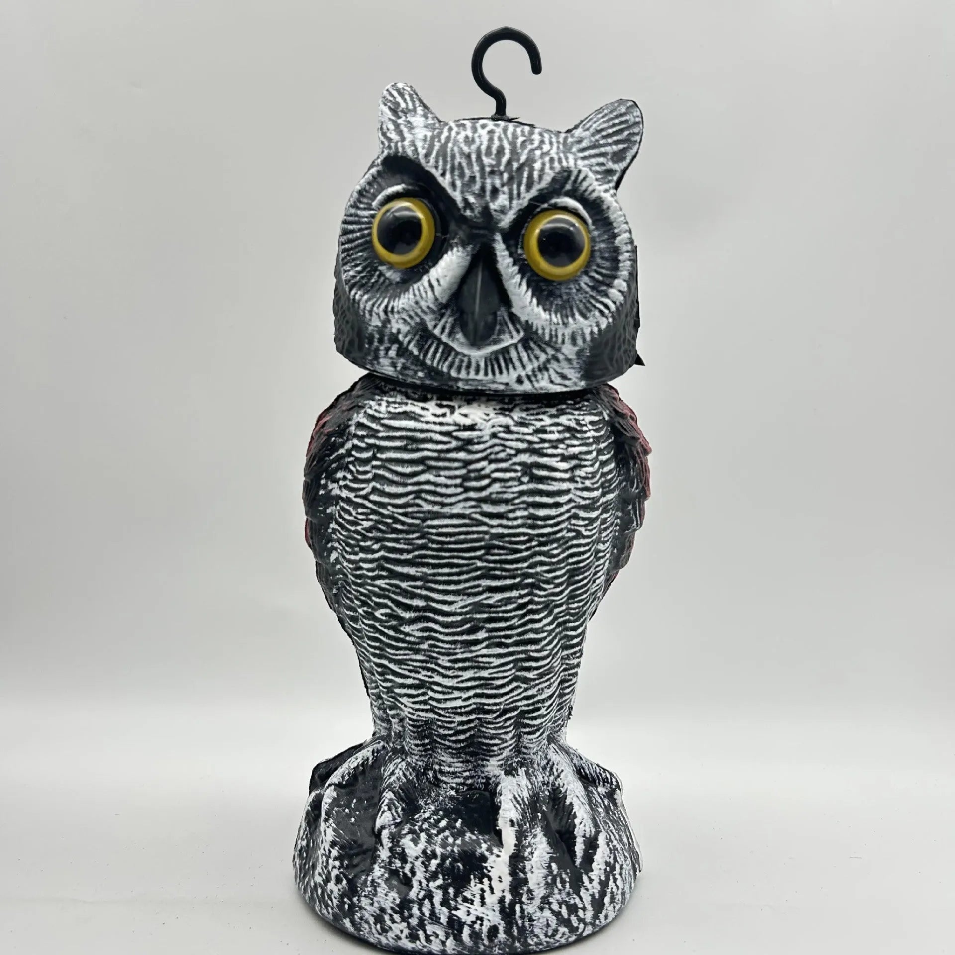 Realistic plastic artificial owl bird deterrent ornament with shaking head, for outdoor use.