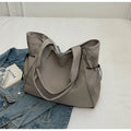 Soft Oxford cloth folding commuter shoulder tote bag shown in light grey colour.