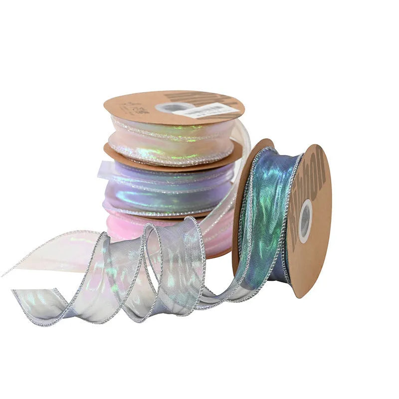 Roll of 4cm wide fishtail yarn mesh ribbon in a choice of eight illusion colours for craft and floral use.