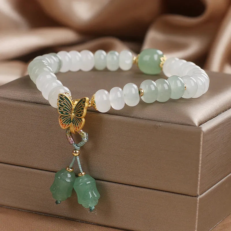 Green Tian Shan Cui abacus beads jade bracelet with butterfly tassel and pearl accents