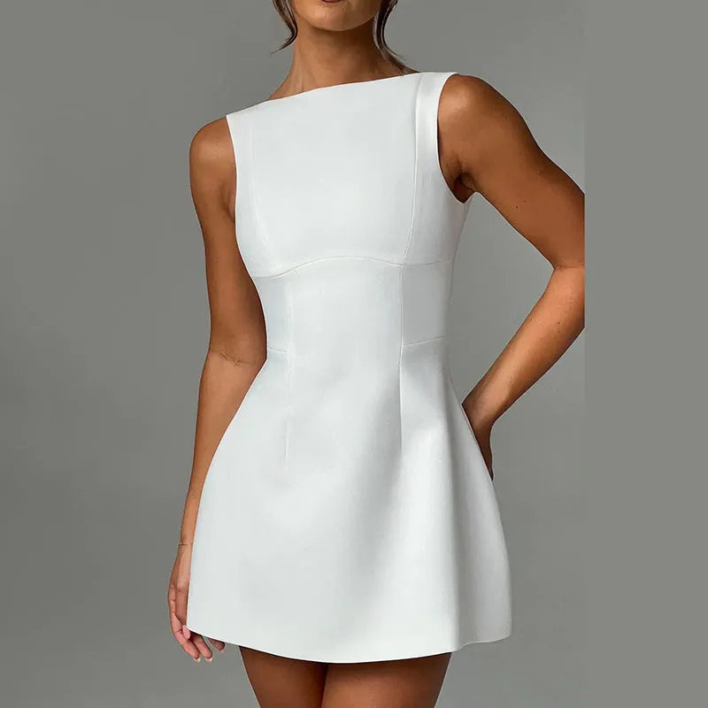 Slim-fitting backless sleeveless summer dress in a solid colour on a hanger, showing high waist and short length.