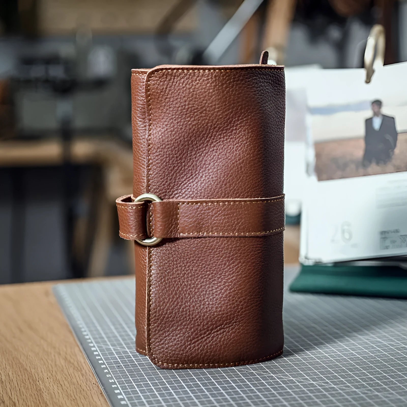 Handmade vintage bifold wallet in genuine cow leather showing tape extraction closure