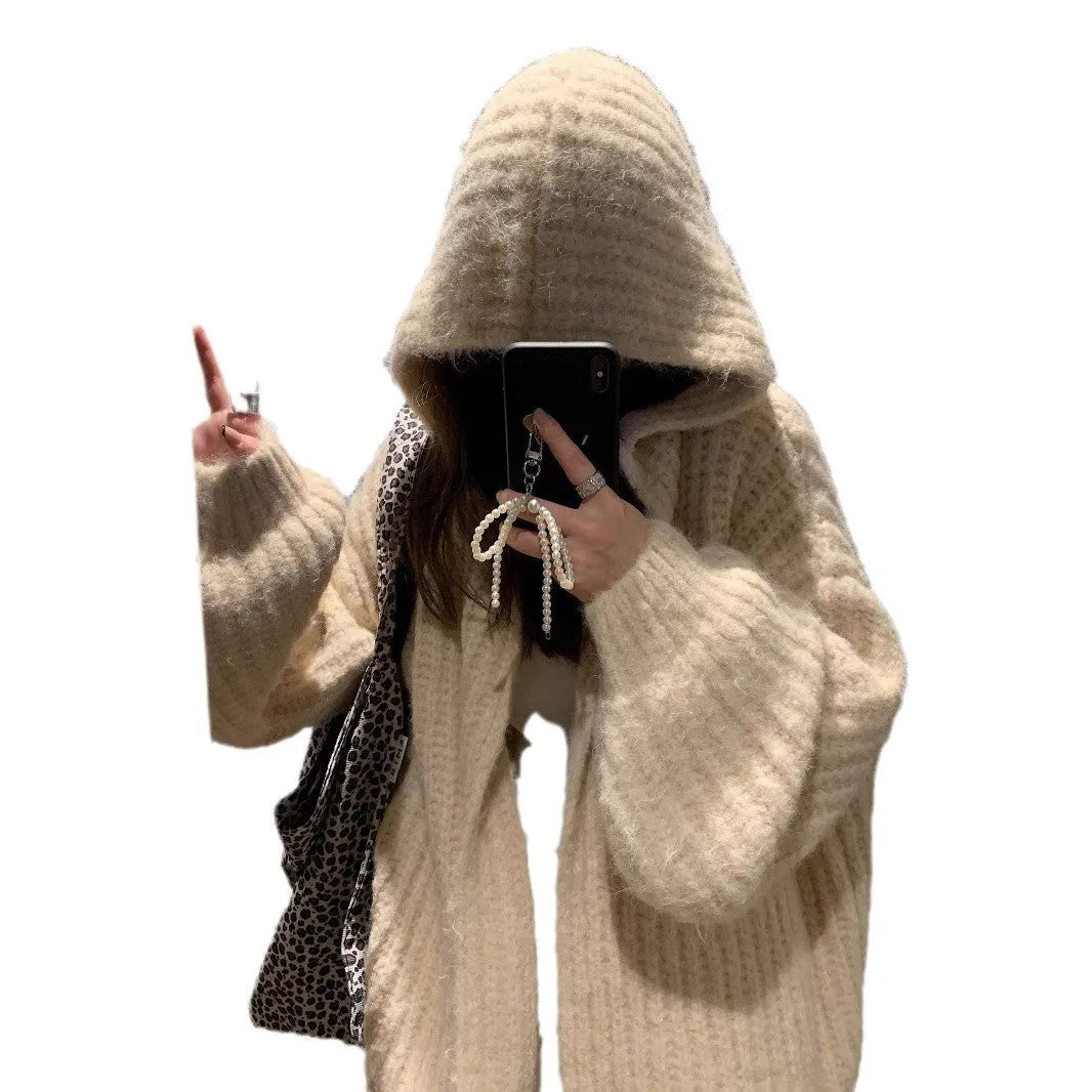A woman's loose-fit hooded sweater cardigan in a thick fabric, shown in dark grey, brown, and milky white colour options.