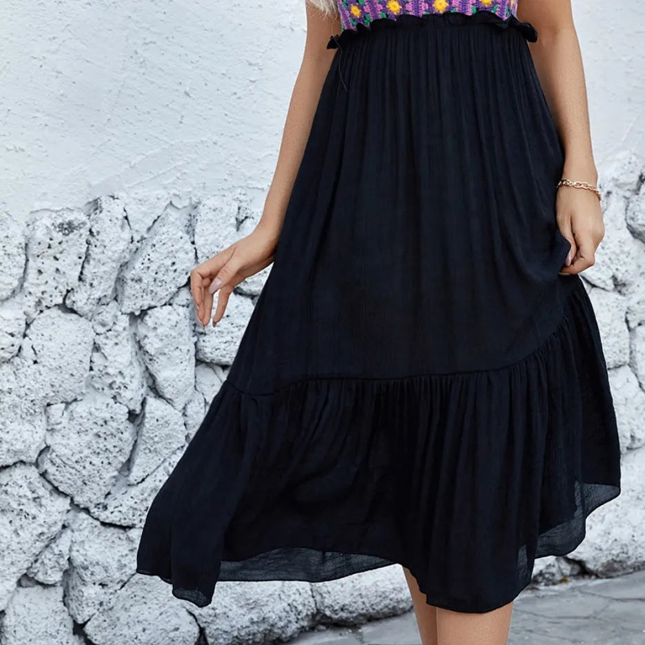 Purple sleeveless dress with floral embroidery, shown on a hanger