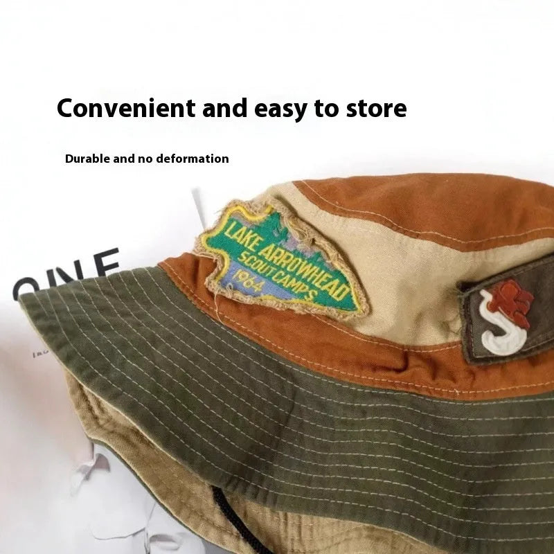 Army green cotton foldable fisherman hat with patchwork details and flat top crown