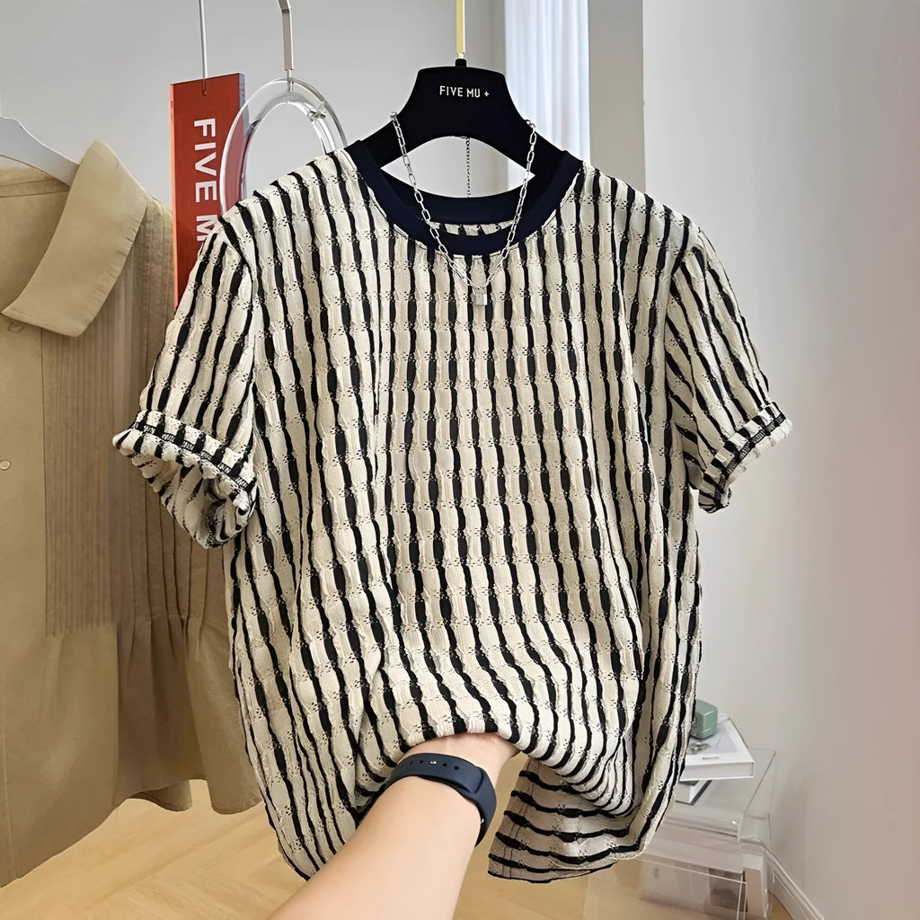 Black and white striped men's loose-fit short sleeve casual shirt made from linen blend fabric.