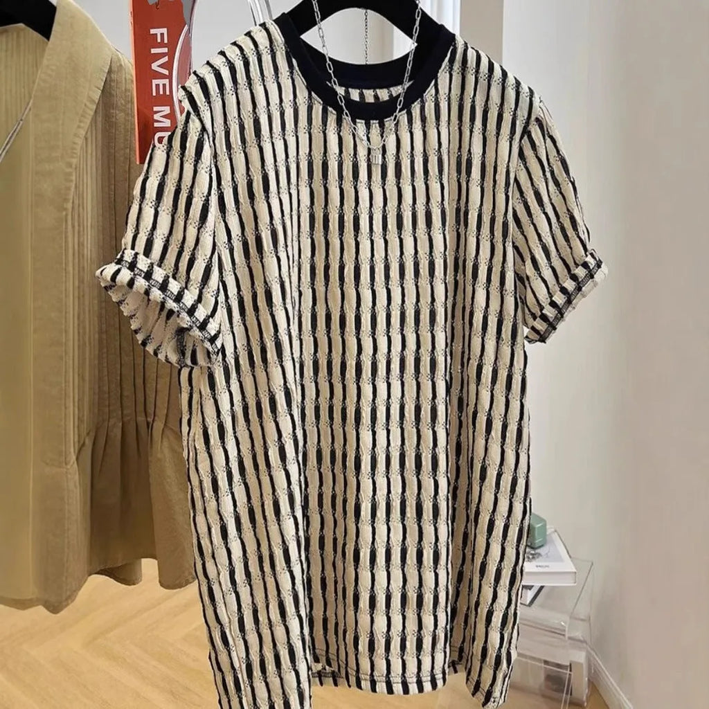 Black and white striped men's loose-fit short sleeve casual shirt made from linen blend fabric.