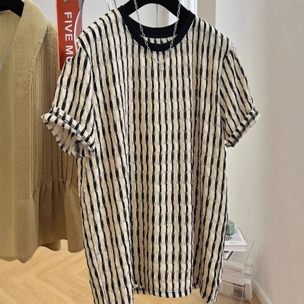 Black and white striped men's loose-fit short sleeve casual shirt made from linen blend fabric.