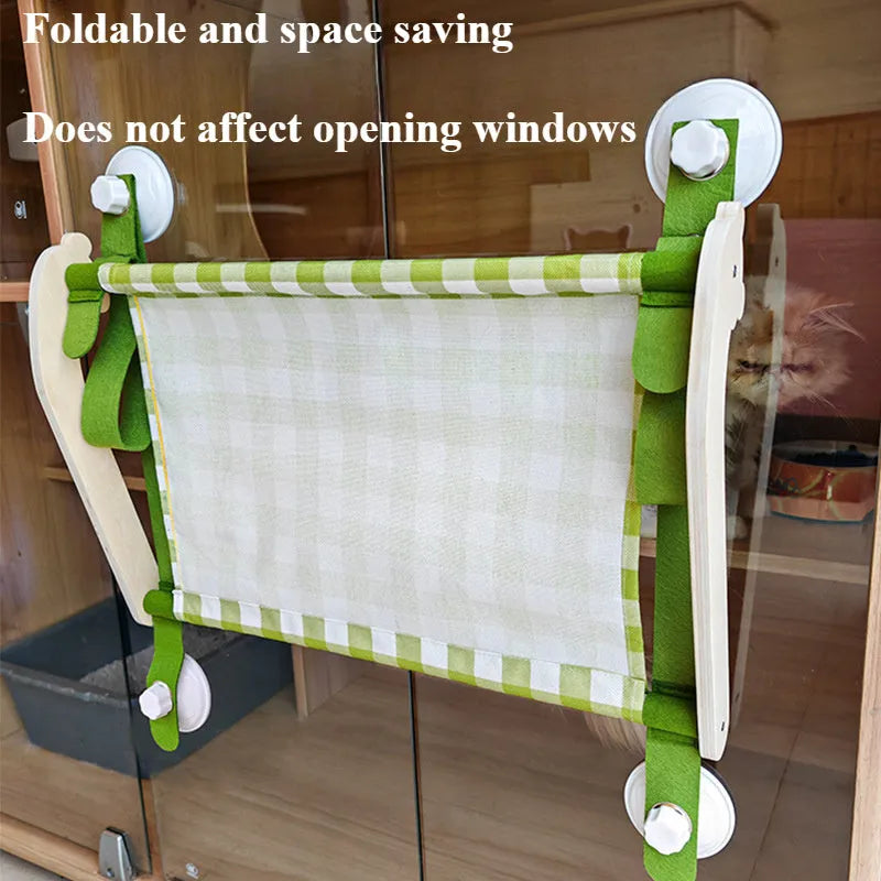 Wooden frame cat window hammock bed with linen fabric attached by suction cups to a window.