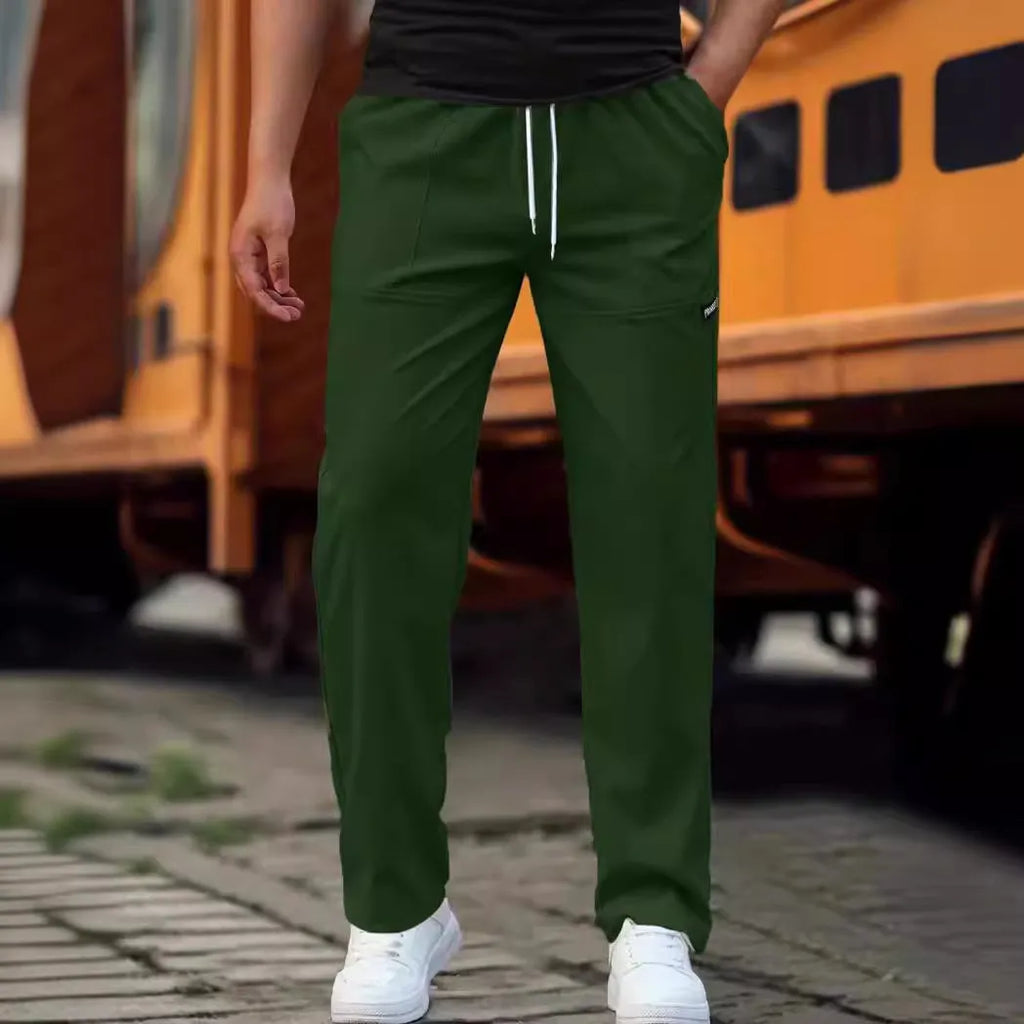 Men's polyester trousers in light grey, shown flat, with a size label indicating S-XXXL range.