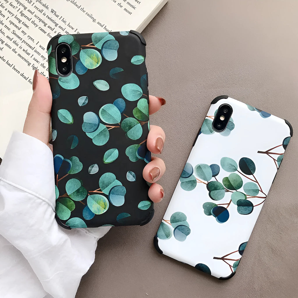 Black silicone phone case with a leaf design for various iPhone models.