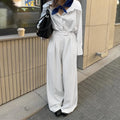 White striped wide-leg commuting trousers with zip closure on Asian-sized mannequin