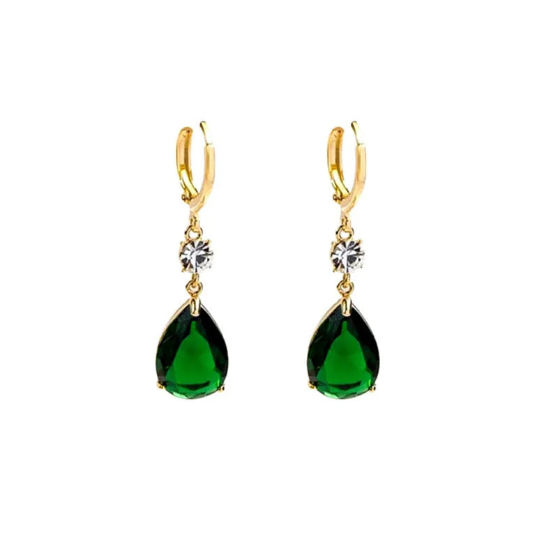 Green geometric teardrop alloy earrings with drop design on display