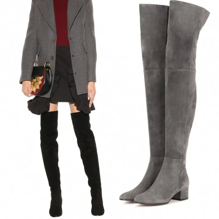 Grey suede women's flat over-the-knee boots with a pointed toe and thick low heel.