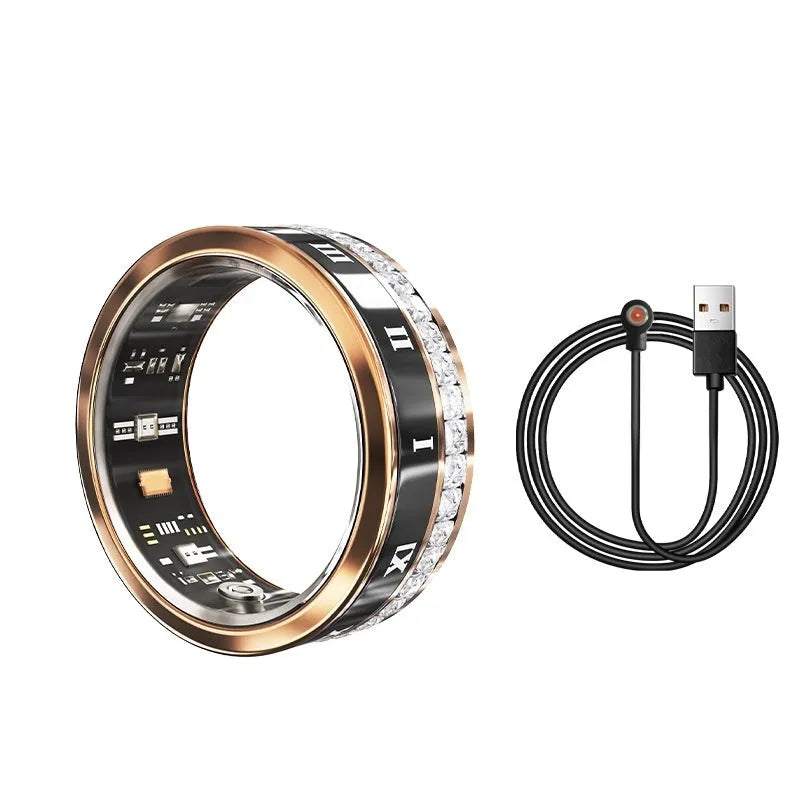 Silver and gold smart ring with diamond inlay on finger, showing charging cable and box.