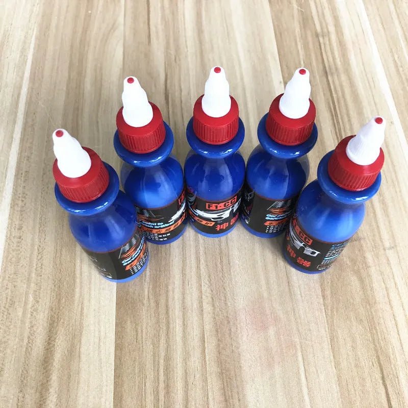 Small blue car wiping tool with scratch repair agent bottle for automotive paint touch-ups