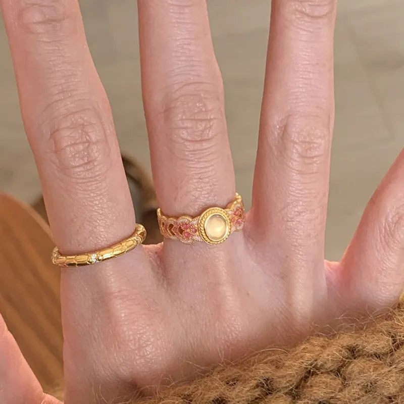 Women's pink crystal enamel adjustable ring with geometric open design on gold-plated copper