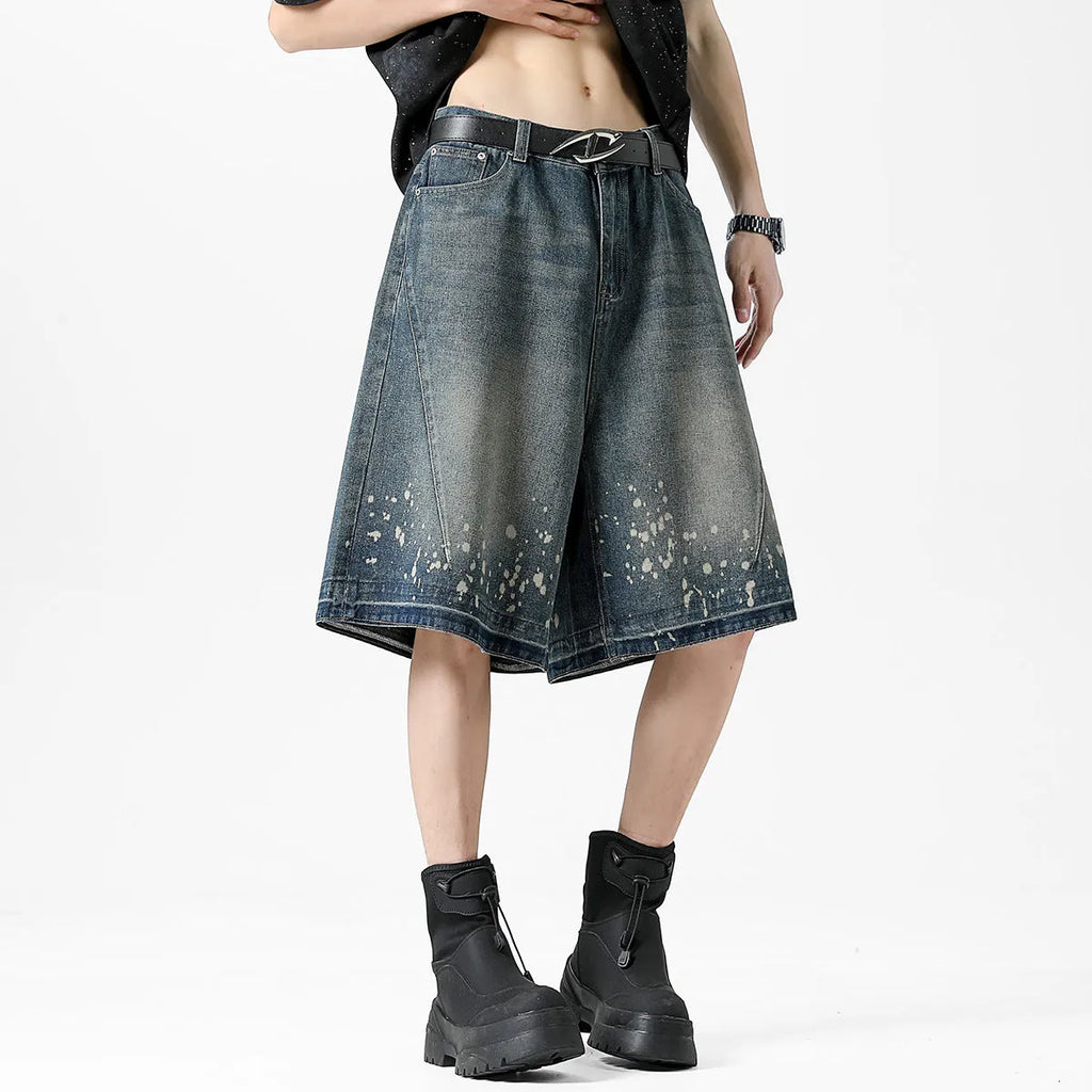 Men's retro blue denim shorts with ripped splash ink pattern and straight cut design
