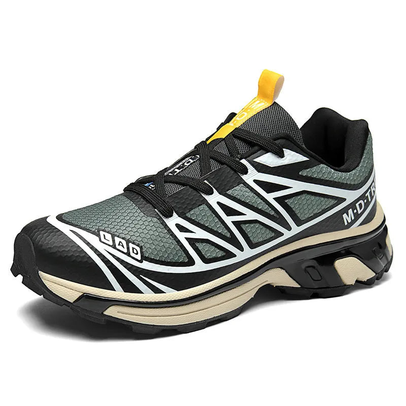 Men's and women's low-top hiking shoes in khaki colour with round toe and lace-up front.
