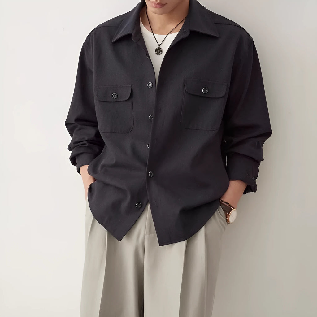 Men's light sand rice long sleeve collared shirt with collage stitch detailing on front.