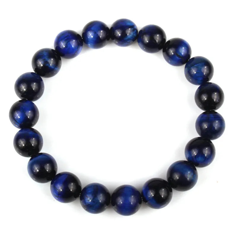 Natural tigereye crystal beaded bracelet with round beads, shown in a selection of colours and sizes on a wrist.