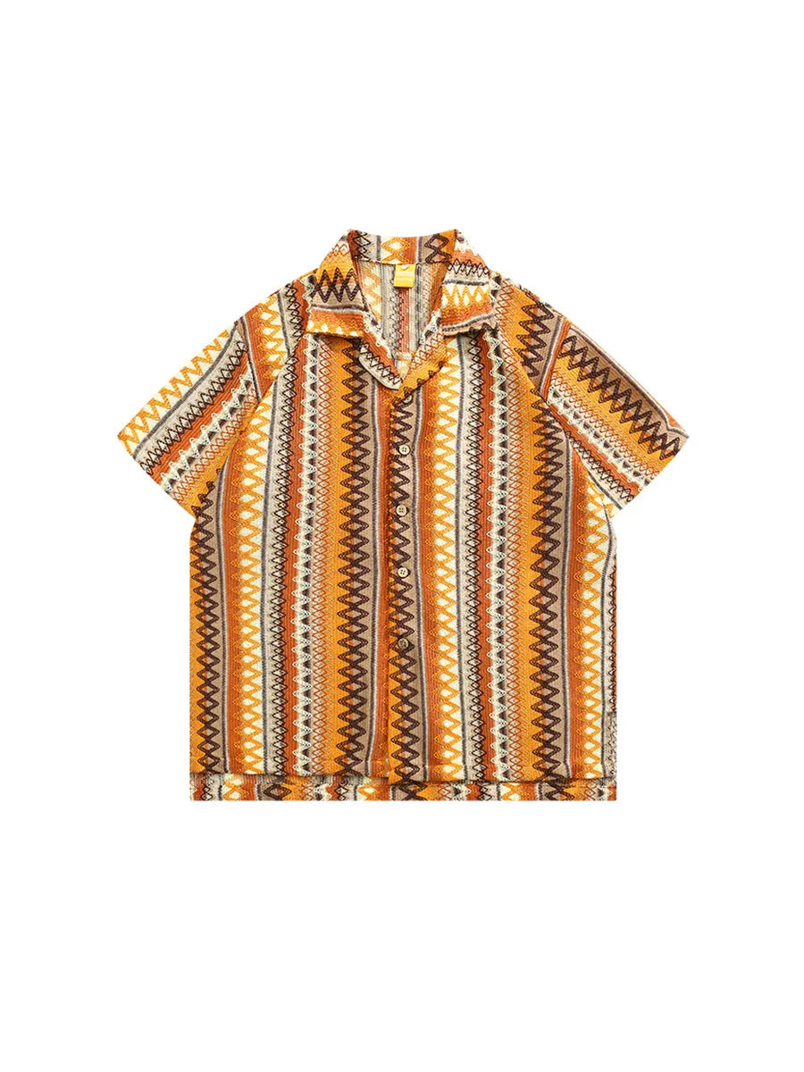 Man modelling a light-coloured ethnic patterned Cuban collar shirt with contrast colours and drop shoulders