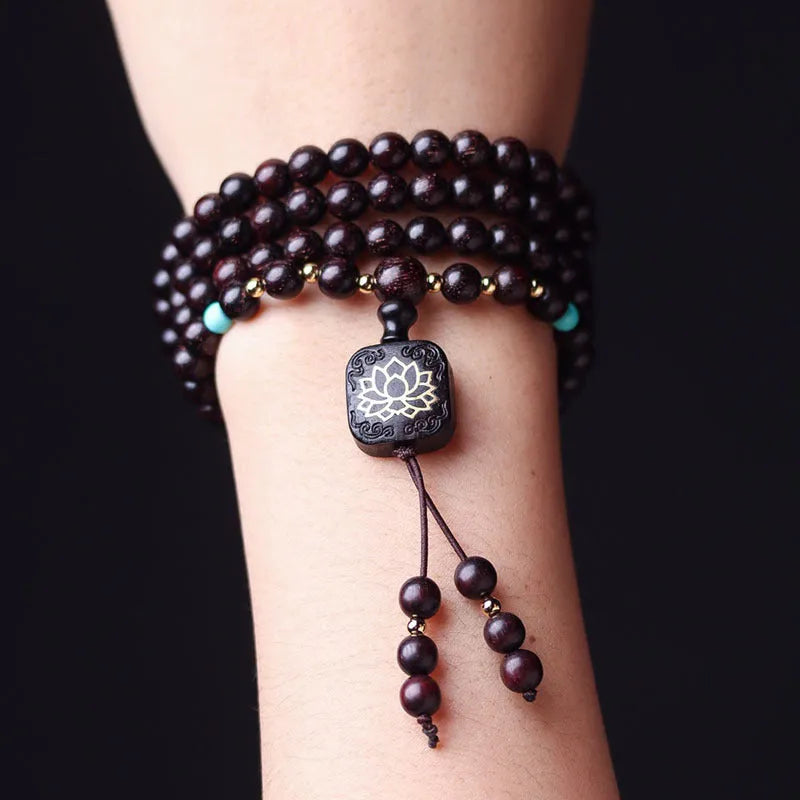Zambia rosewood bead bracelet with flat lotus pendant showing 108 wooden beads