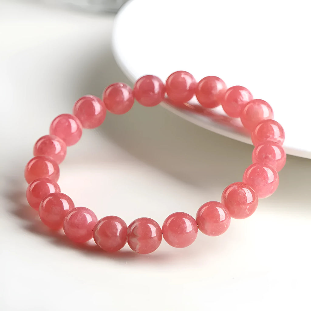 Women's geometric crystal bracelet with longevity lock in natural red rhodochrosite stone patterns