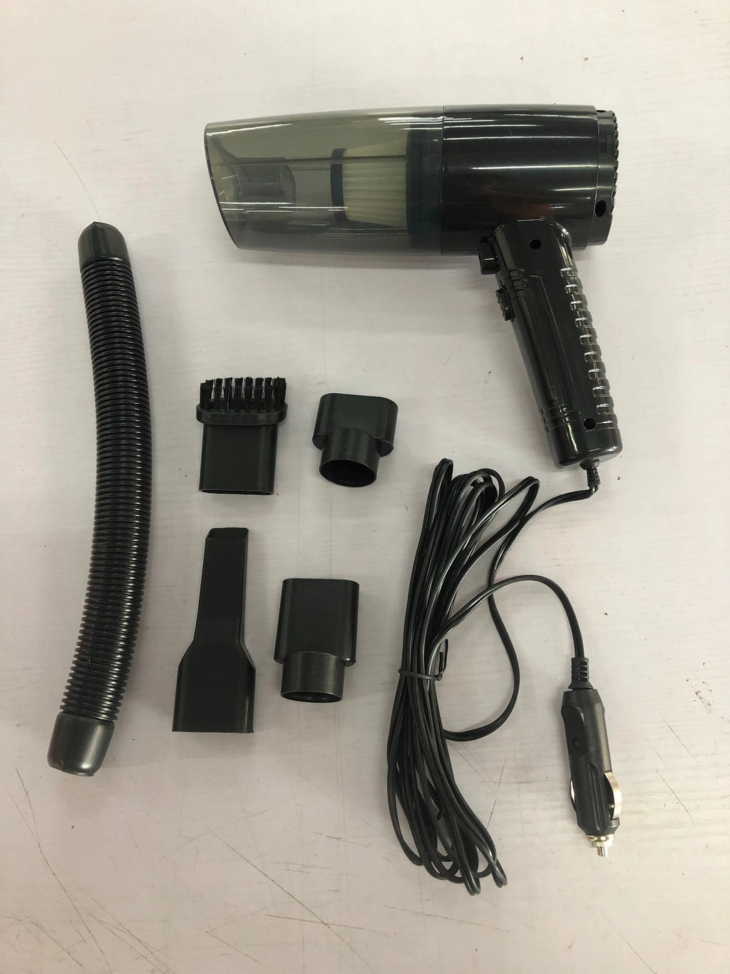 Car vacuum cleaner in black or white with five suction head accessories and 5-metre power cord