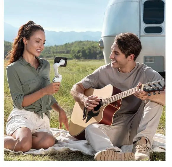 Magnetic mobile phone PTZ motorised gimbal stabiliser unit with integrated battery on a table
