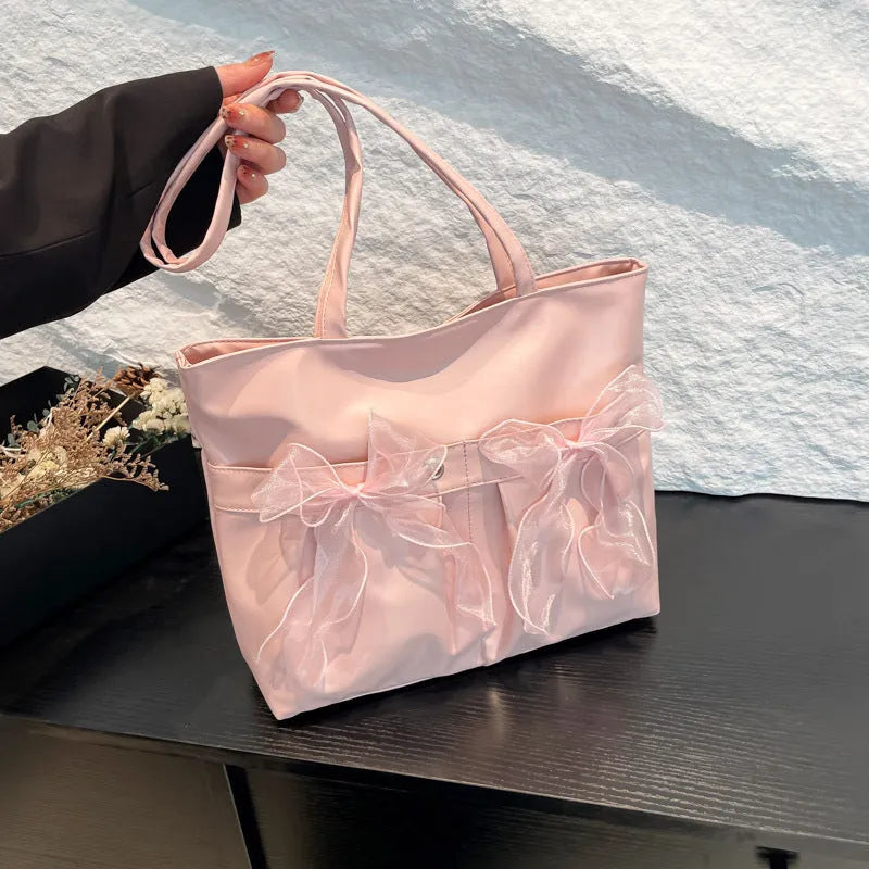 College style bow tote bag in PU leather with double shoulder straps and internal zipper organiser